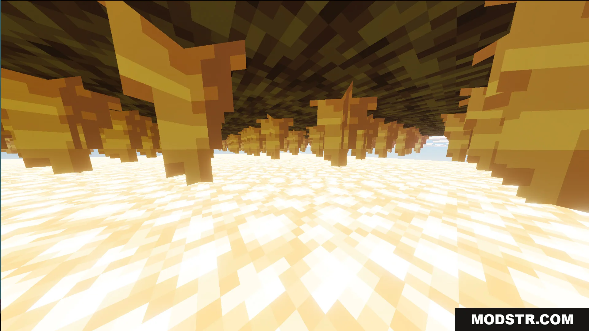 Stalactite like blocks hanging from a dark ceiling above a glowing floor