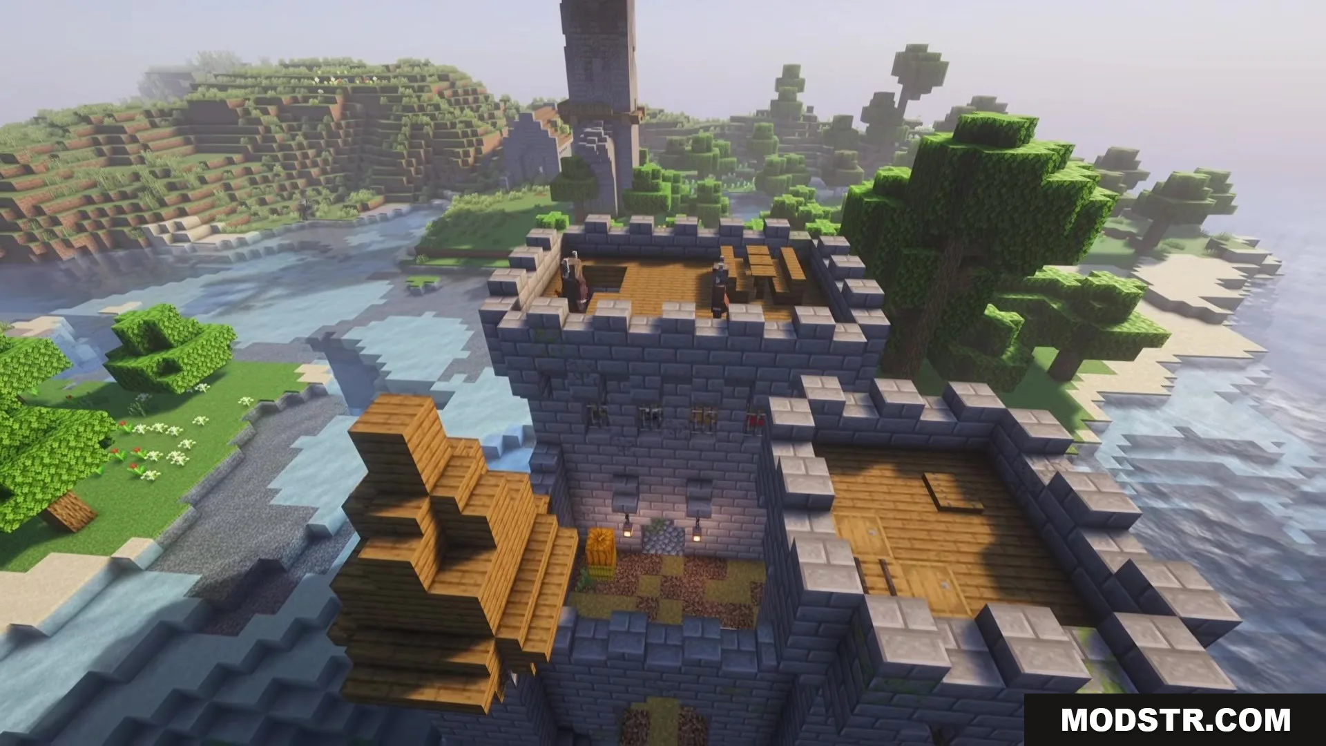 Human allies stand on the roof of a large stone castle near water