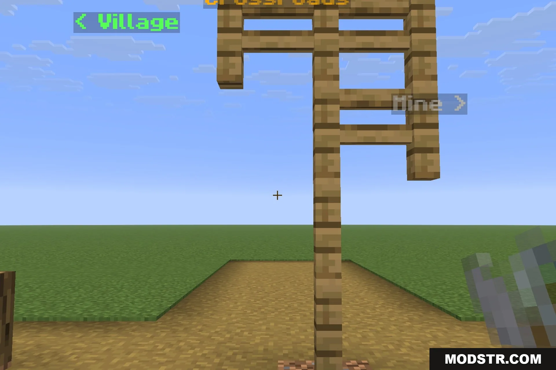 A signpost at a crossroads with three labels pointing different ways
