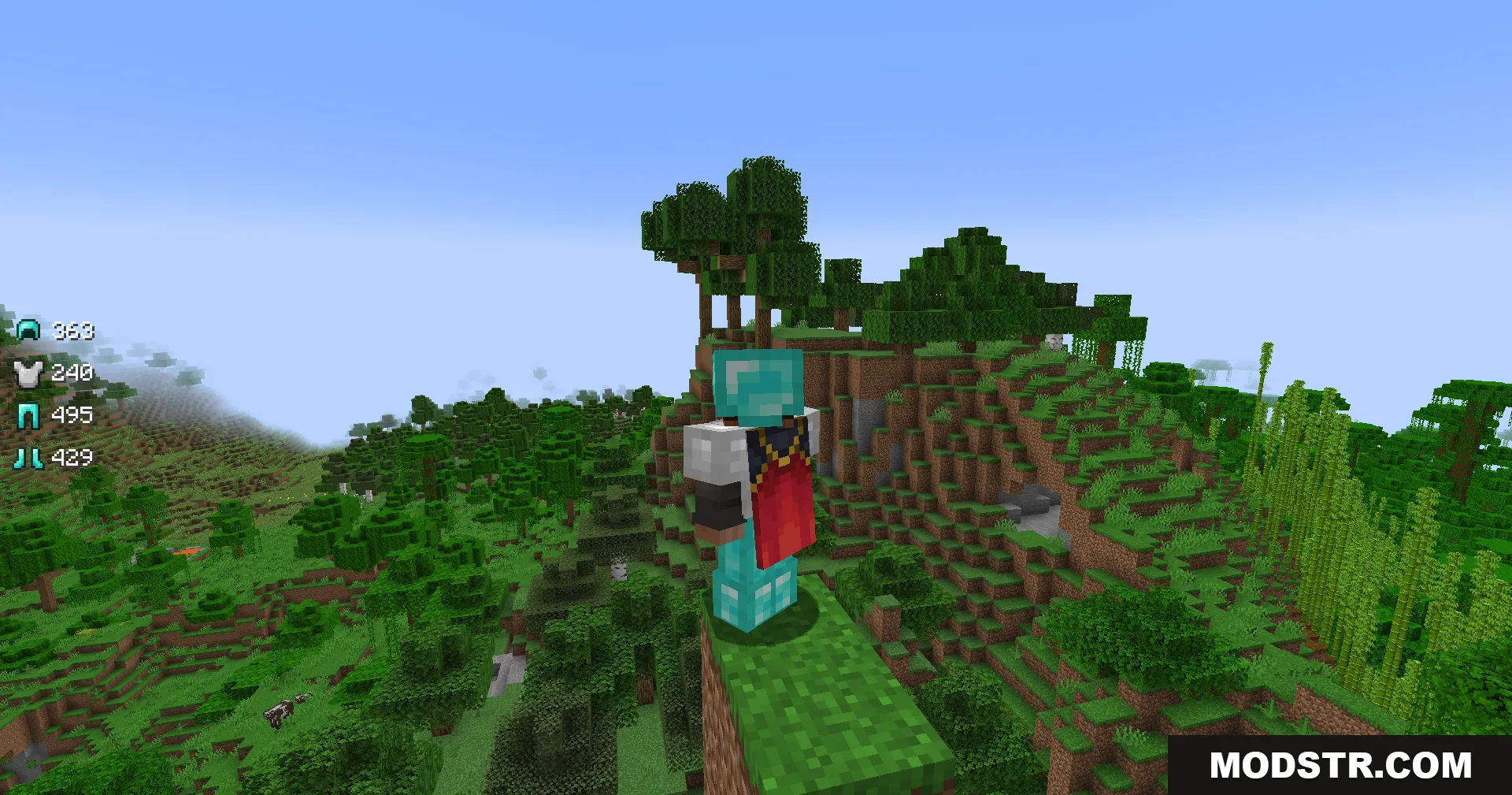 Armor Status Mod Screenshot 3 A Minecraft player wearing armor stands on a cliff overlooking a jungle biome