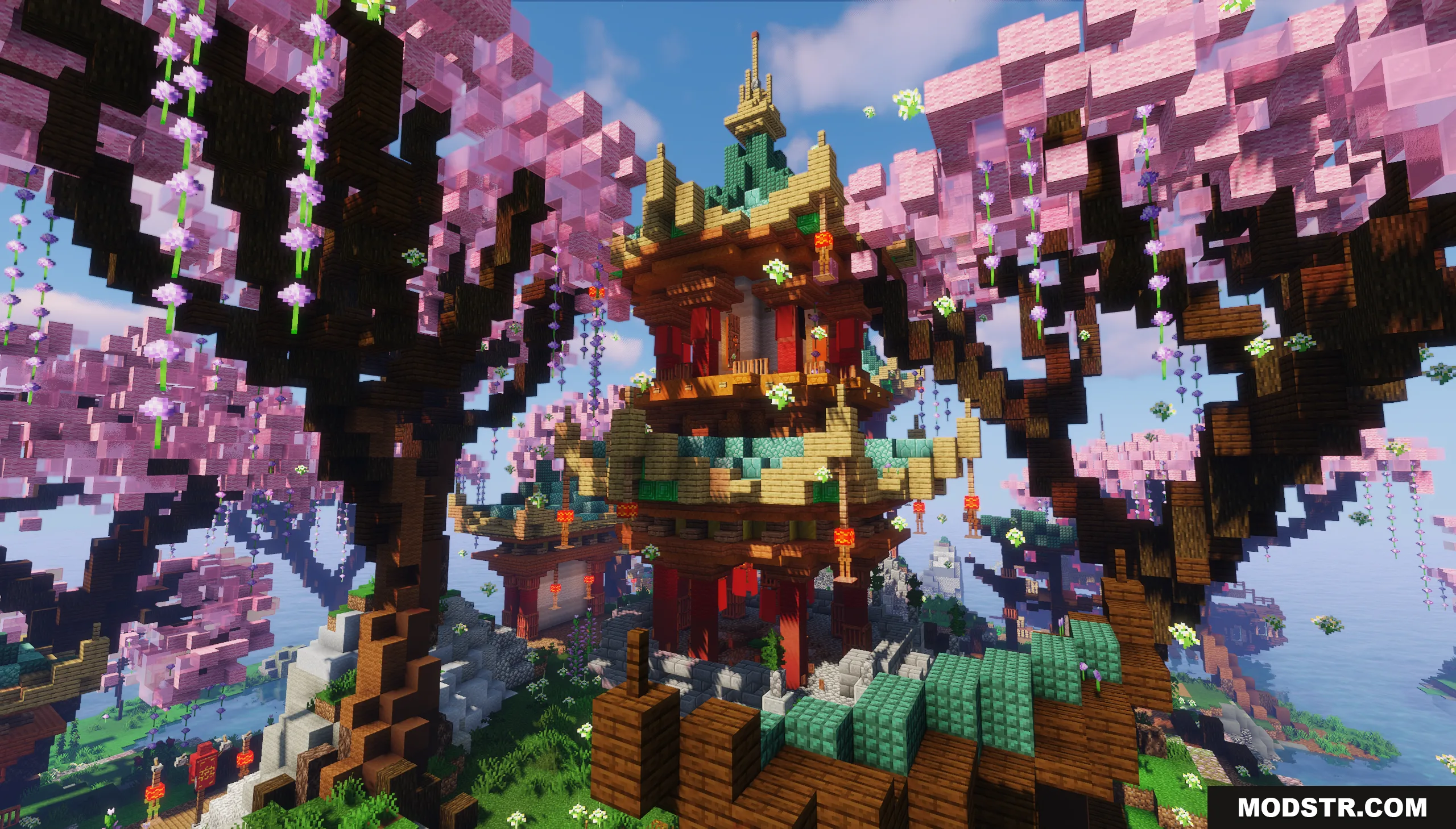 A tall Asian pagoda stands surrounded by blooming pink cherry blossom trees