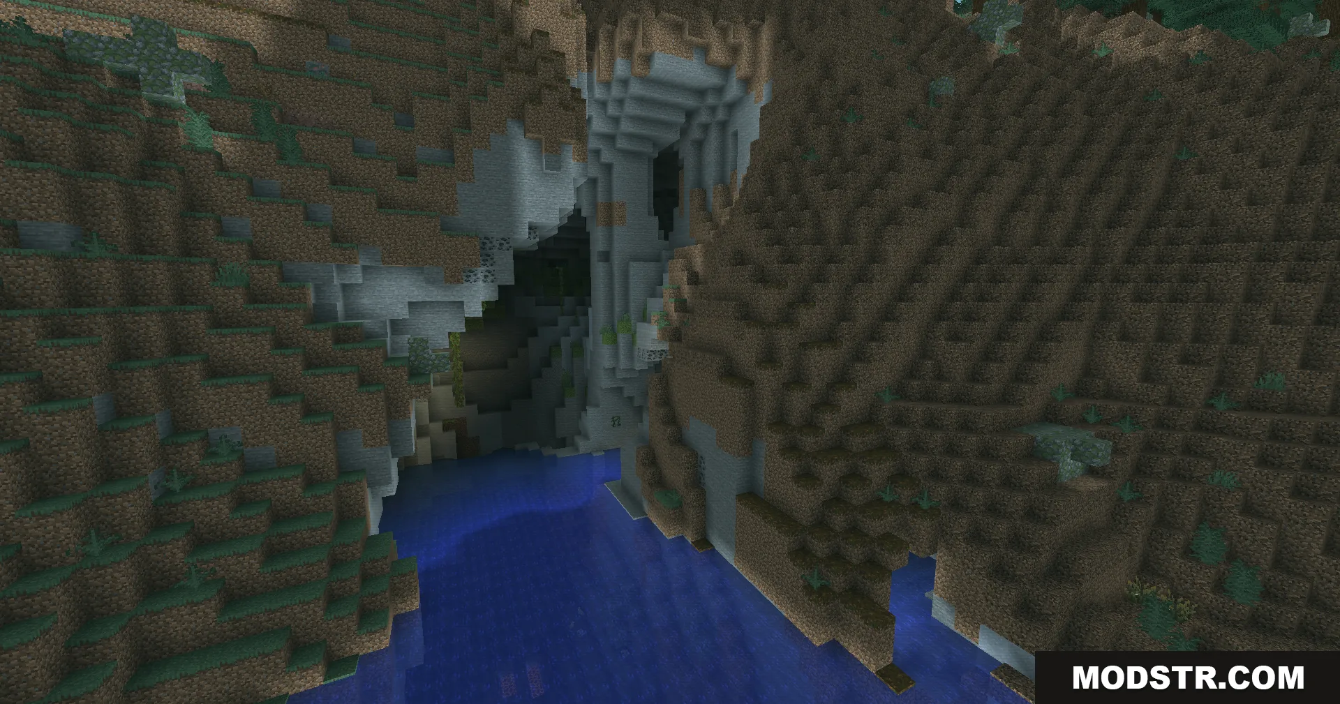 A dark cave entrance and rocky cliffs overlooking blue water with teal lighting