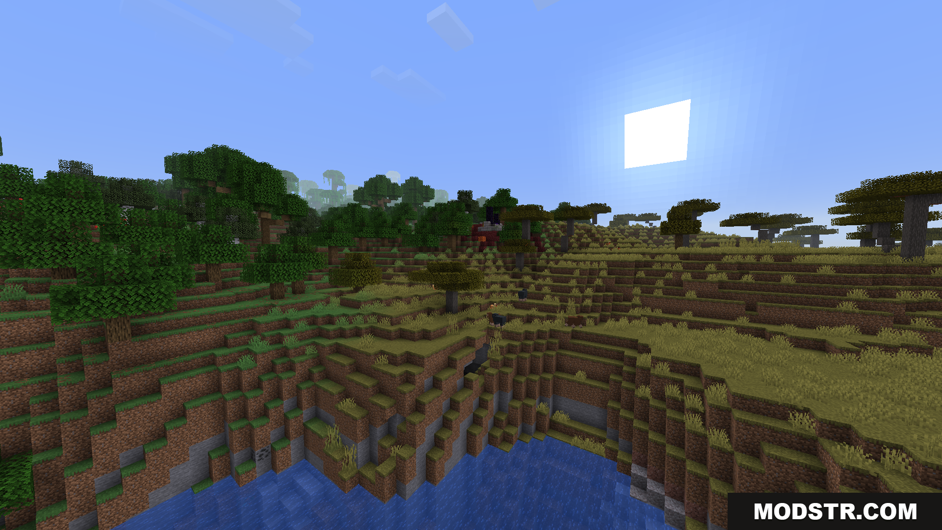 BCLib Neoforge Mod Screenshot 4 Wide view of a savanna biome next to a large lake