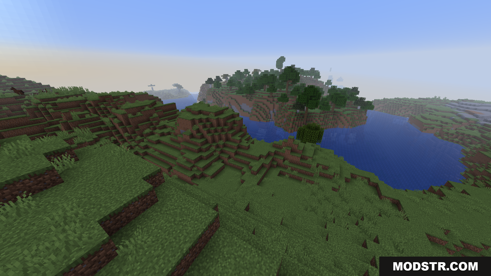 BCLib Neoforge Mod Screenshot 2 Green grassy hills and a blue river in Minecraft landscape