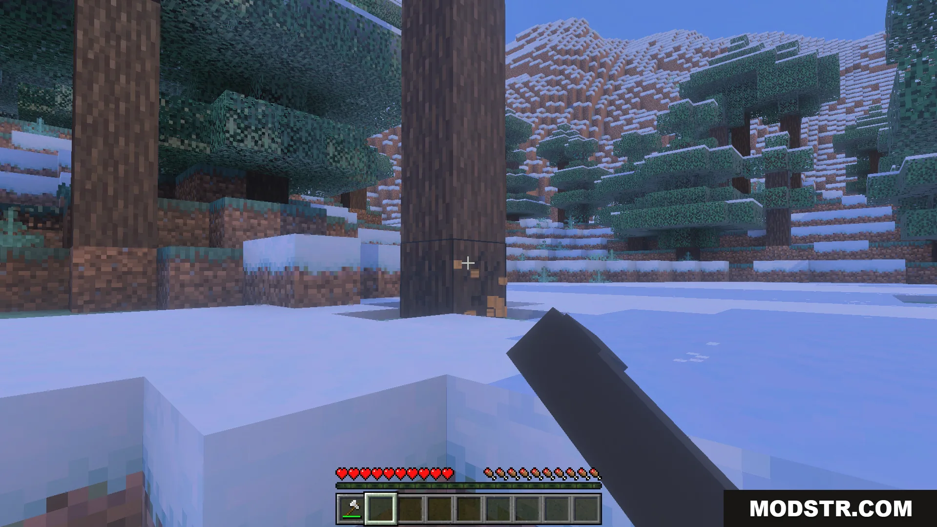 Bedrock Tree Capitator Addon Screenshot 4 Player uses an axe to chop a tall spruce tree in snowy terrain