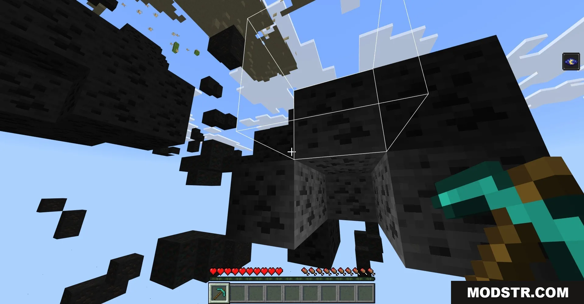 Minecraft player holding a diamond pickaxe while looking at highlighted coal ore blocks