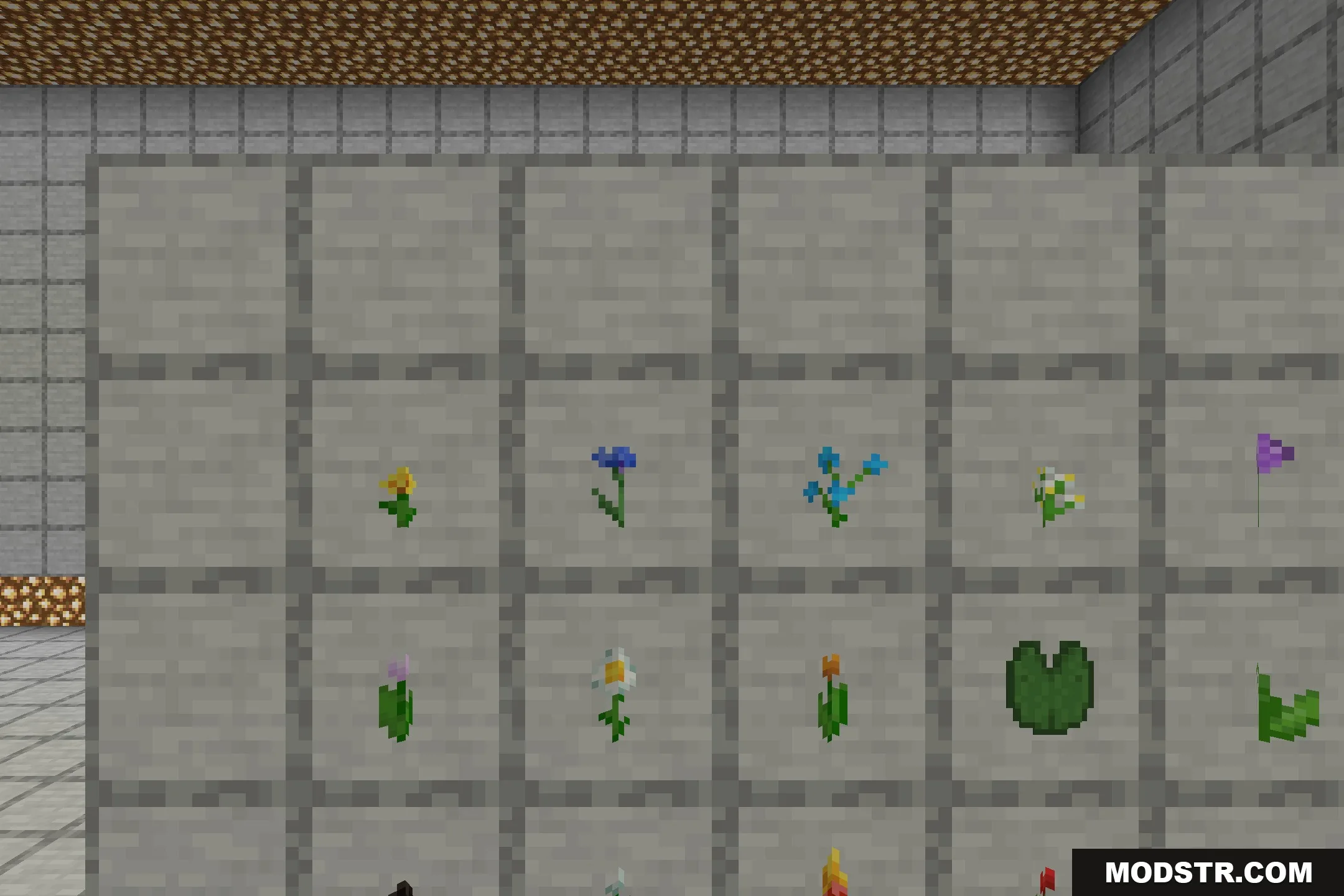 Better Foliage Add-on Resource Pack Screenshot 3 Various Minecraft flowers and a lily pad displayed in item frames on stone