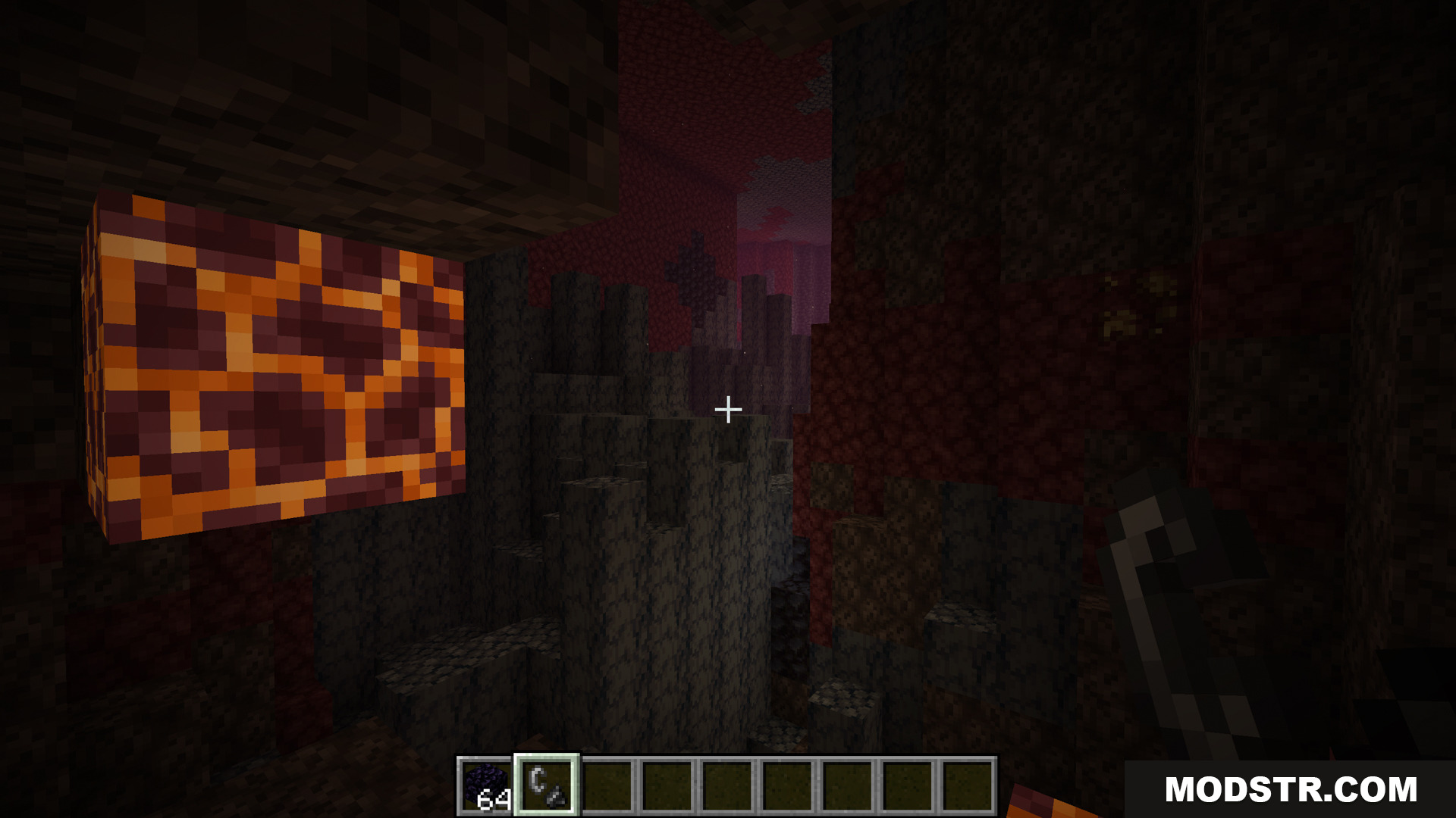 Betternether Forge Mod Screenshot 9 A glowing magma block inside a dark Nether cave