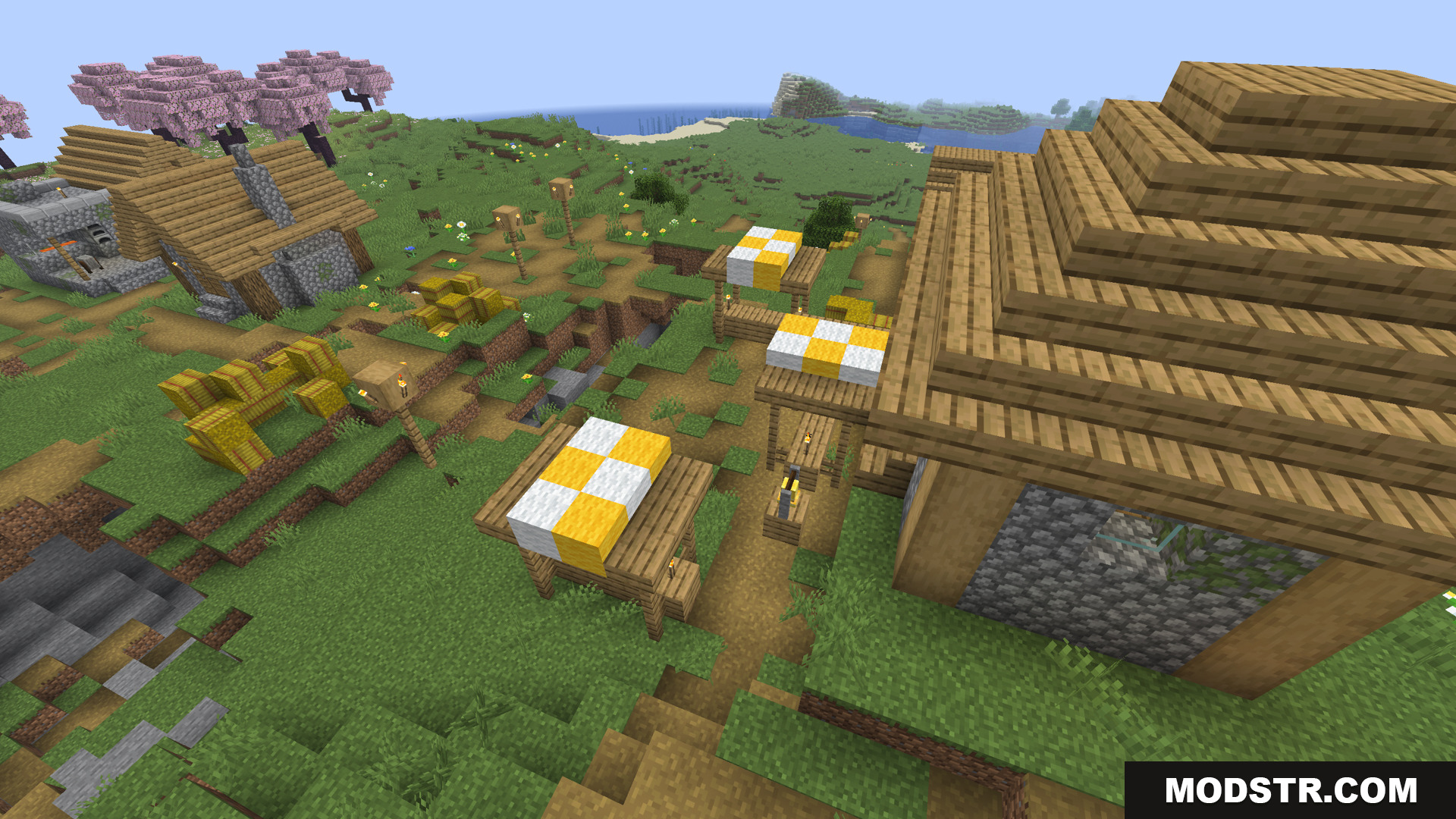 Village scene with market stalls and cherry blossom trees