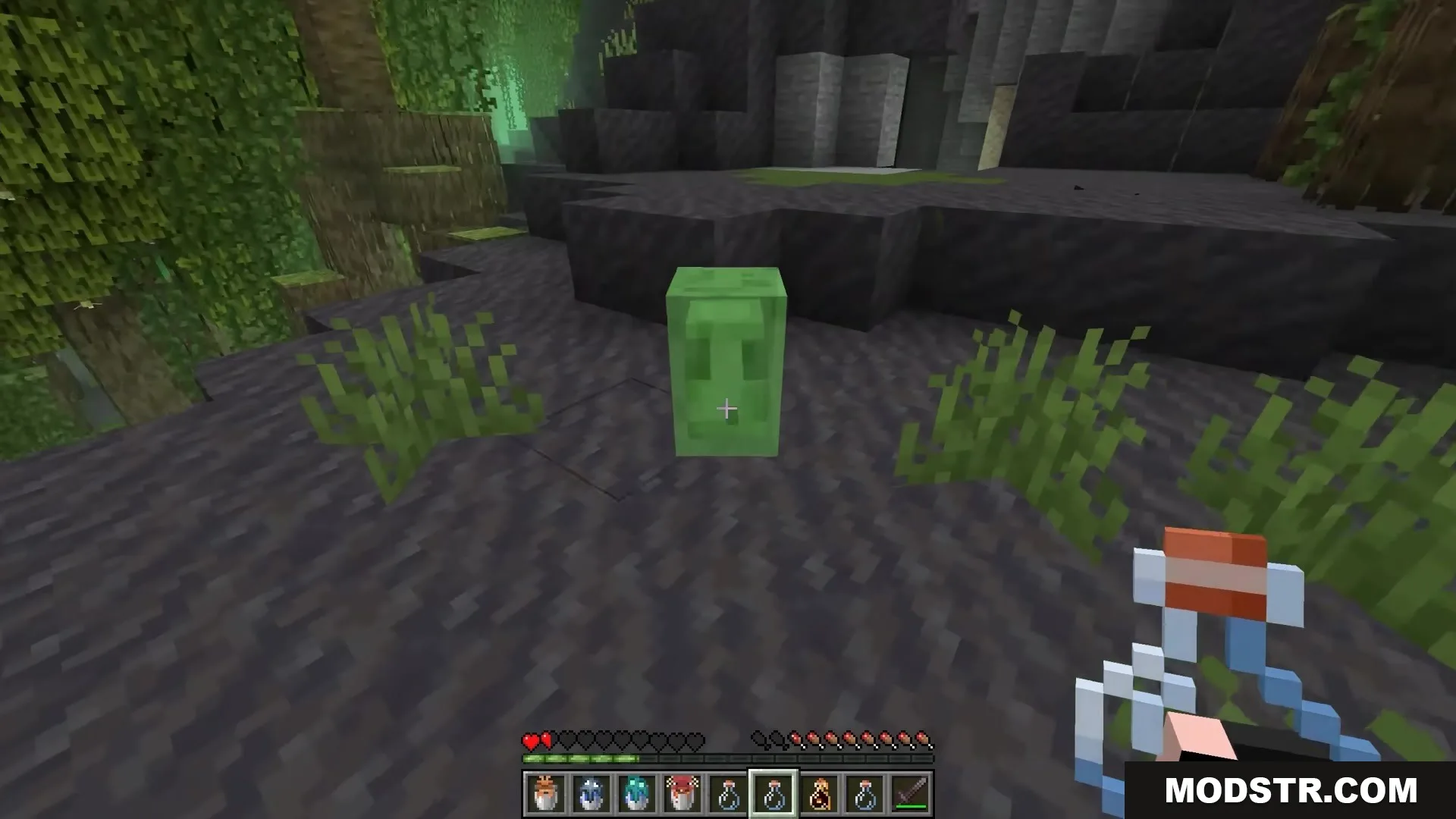 Bucket Em Remodeled Resource Pack Screenshot 1 A player approaches a small green slime with an empty glass bottle