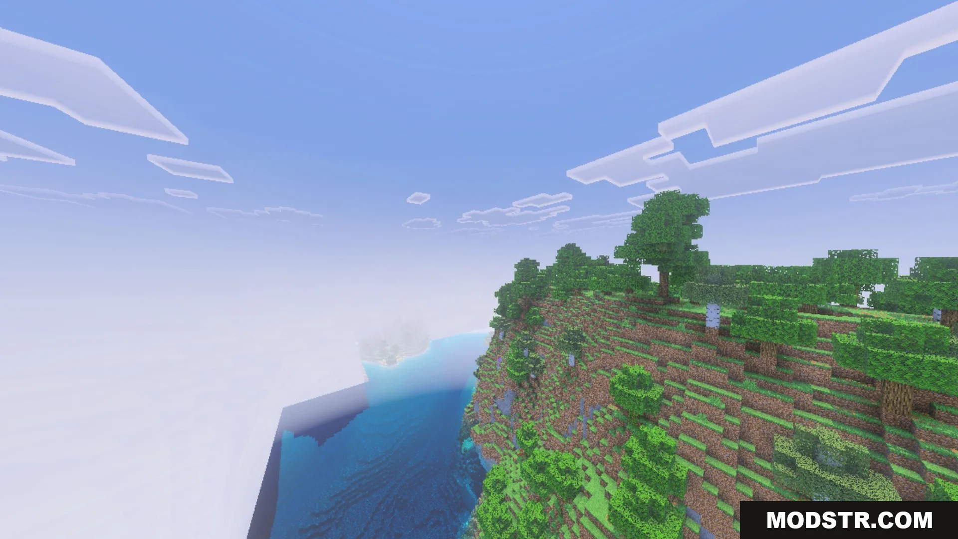 CLEAR FOG VISUAL Shader Screenshot 1 A high angle view of a grassy cliff overlooking the vast blue ocean