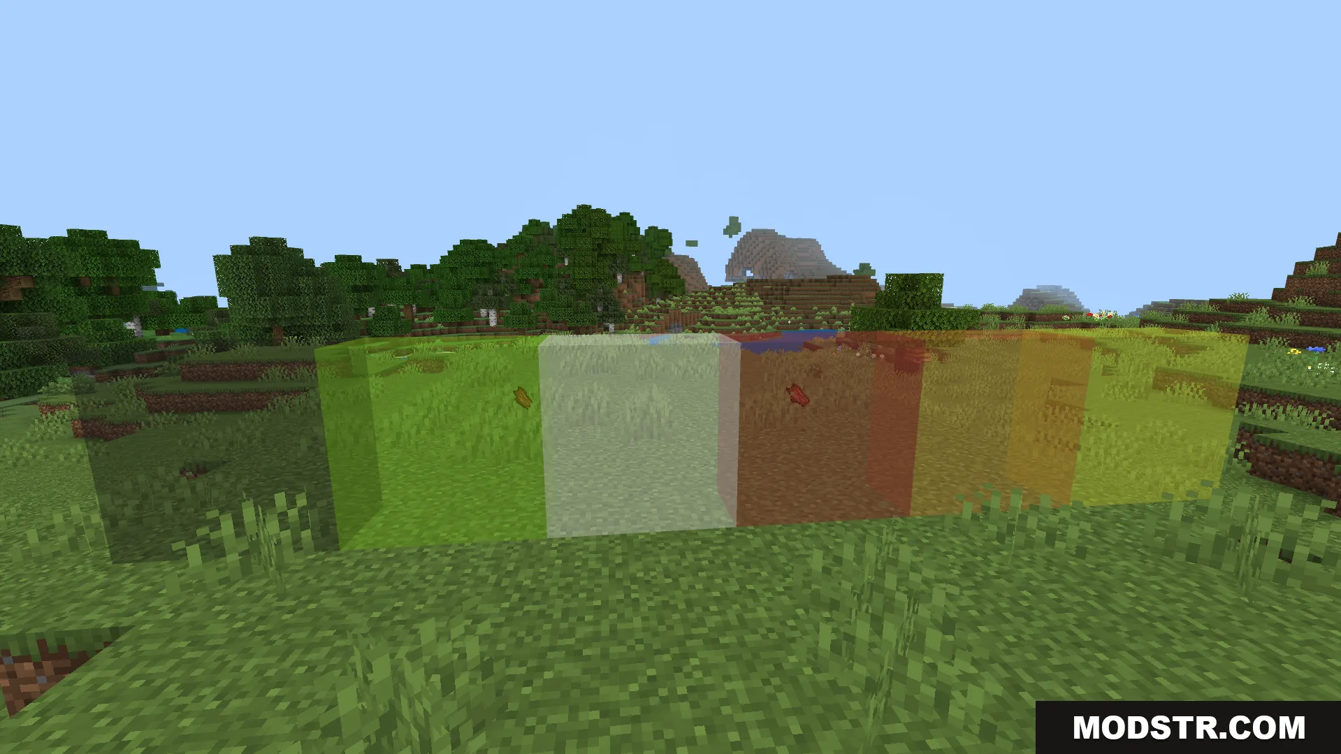 Clear Glass Texture Pack Screenshot 3 Different colored transparent glass blocks placed in a row on grass