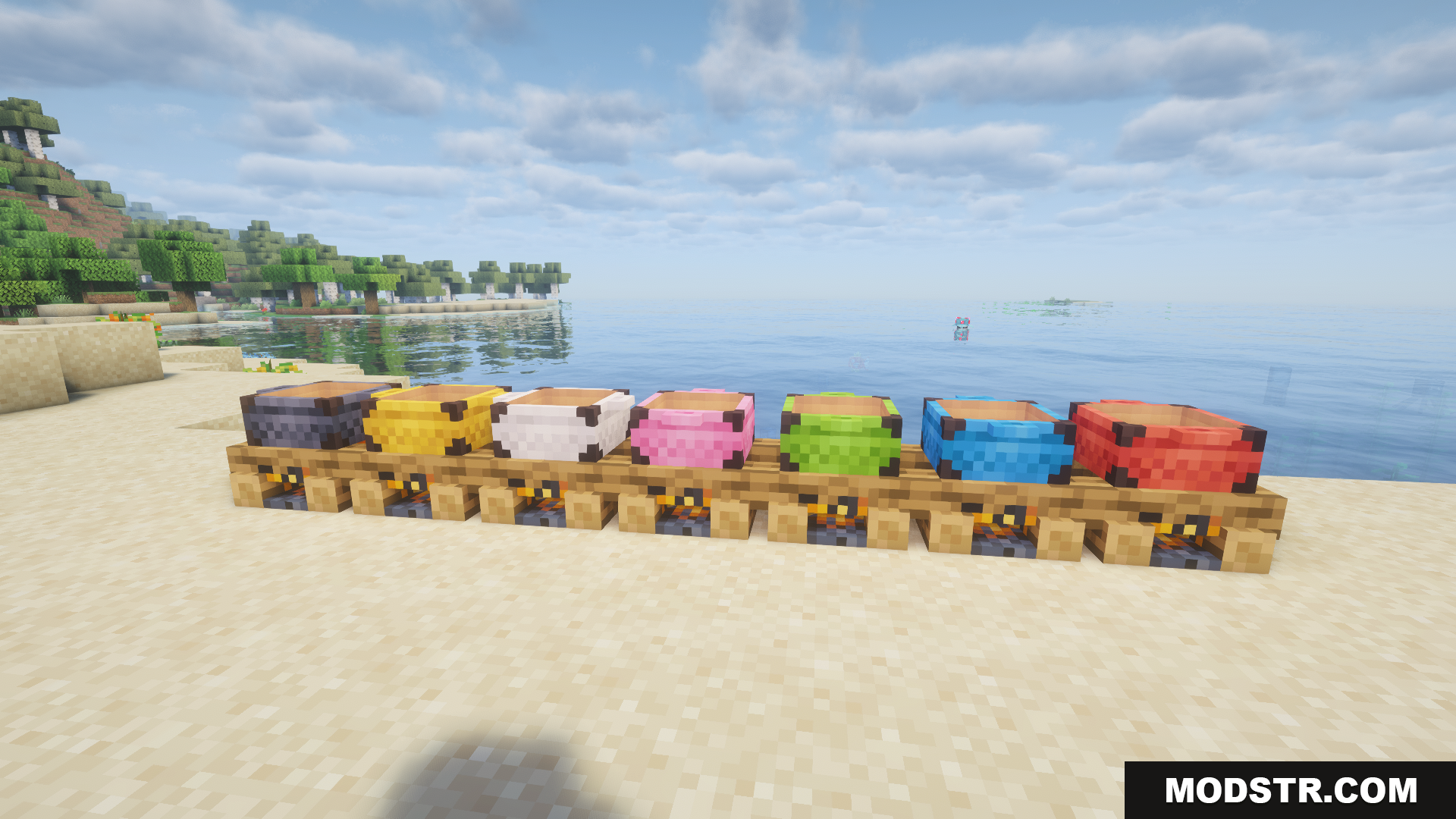 Multiple colored campfire pots placed on top of lit campfires