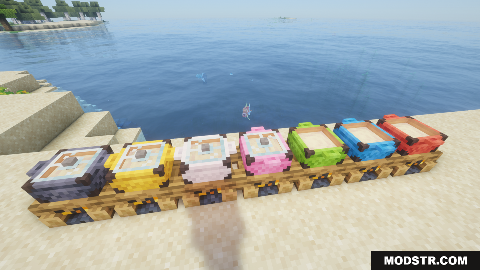 Multiple tiers of colorful campfire pots lined up on the beach