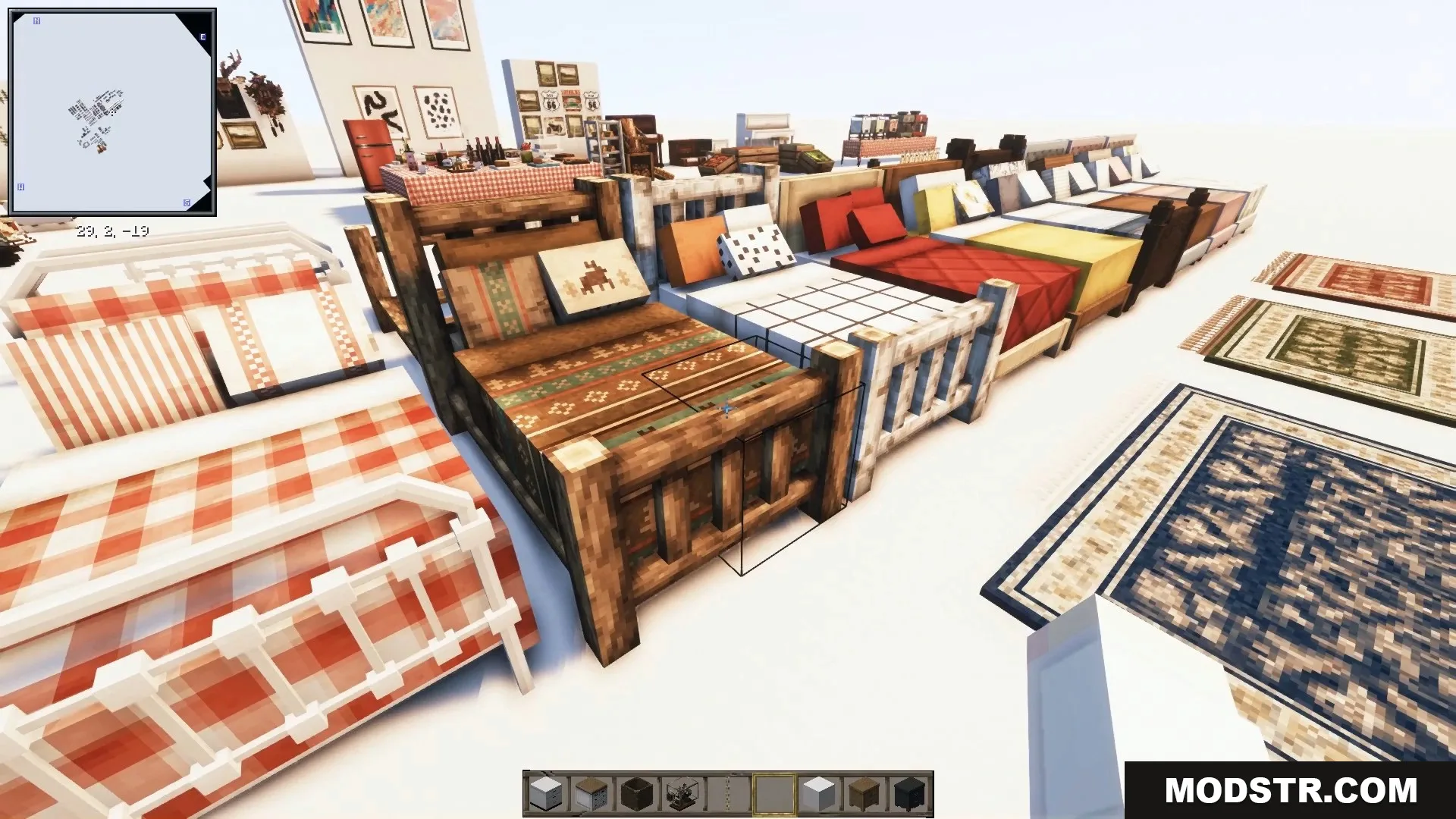 Cozy beds with patterned blankets and pillows lined up next to decorative rugs.
