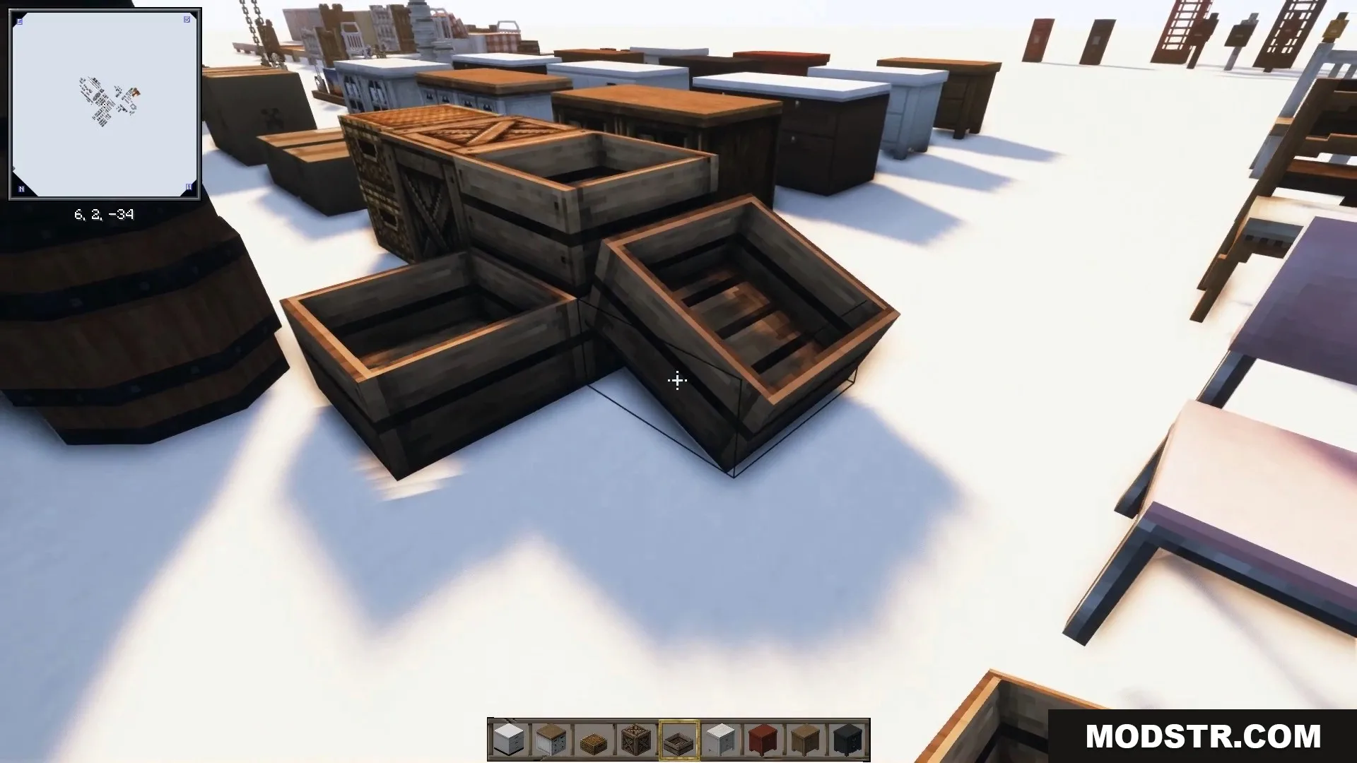 Empty wooden crates stacked neatly beside a large rustic barrel.