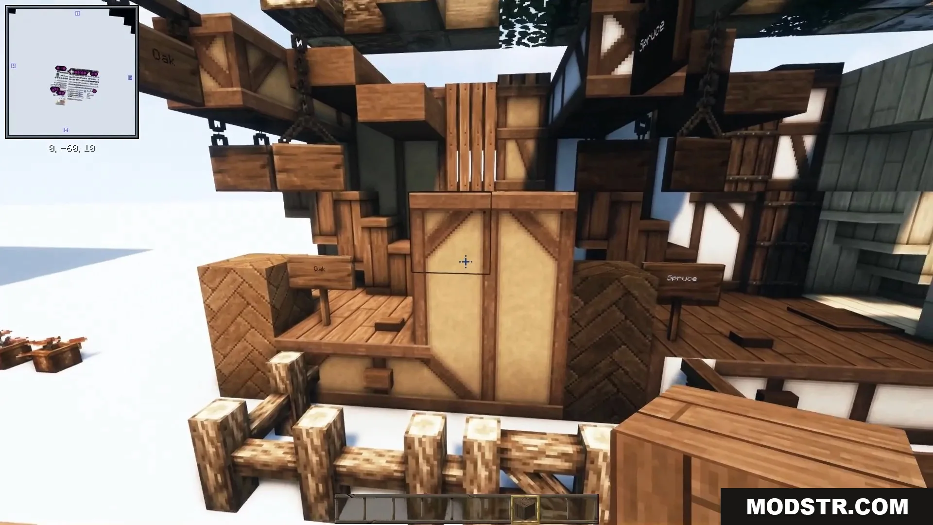 Various wooden beams, fences, and textured blocks highlight realistic building materials.