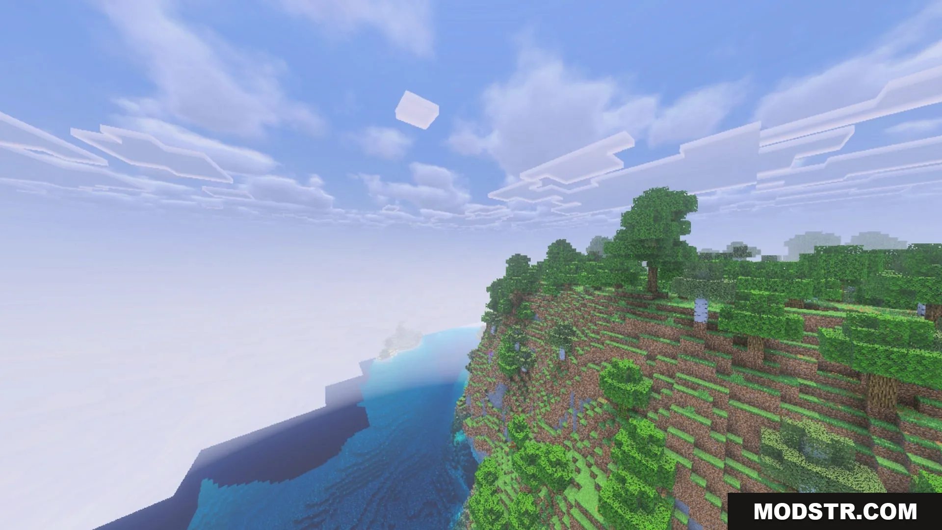 Complementary Unbound Clouds Shader Screenshot 5 Complementary Unbound Clouds shader showing soft white clouds over a steep cliffside