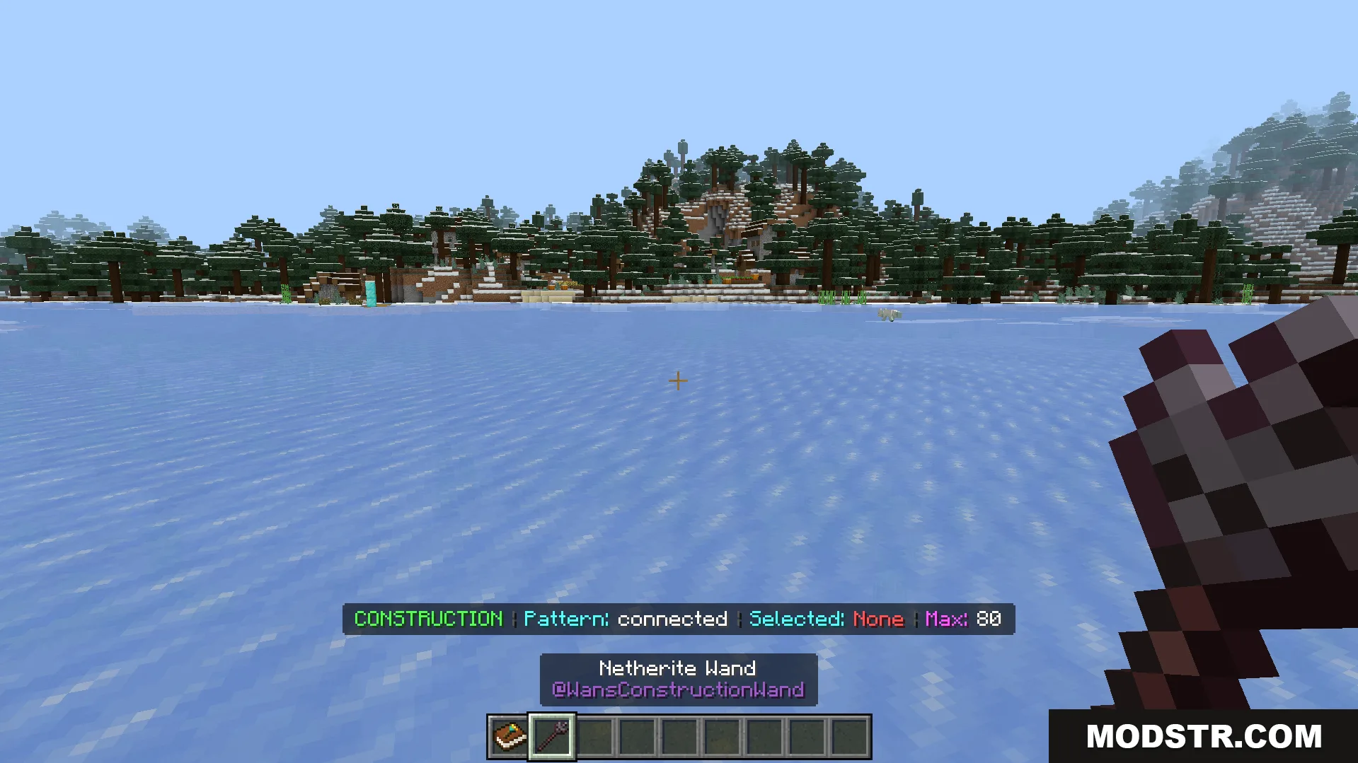 Construction Wands Addon Screenshot 5 Player holding a netherite wand with construction mode active on ice