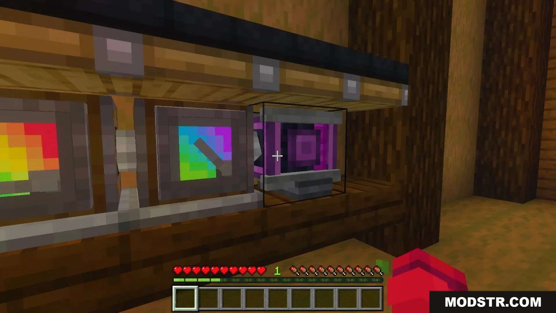 A player interacting with a purple machine block with a colorful screen