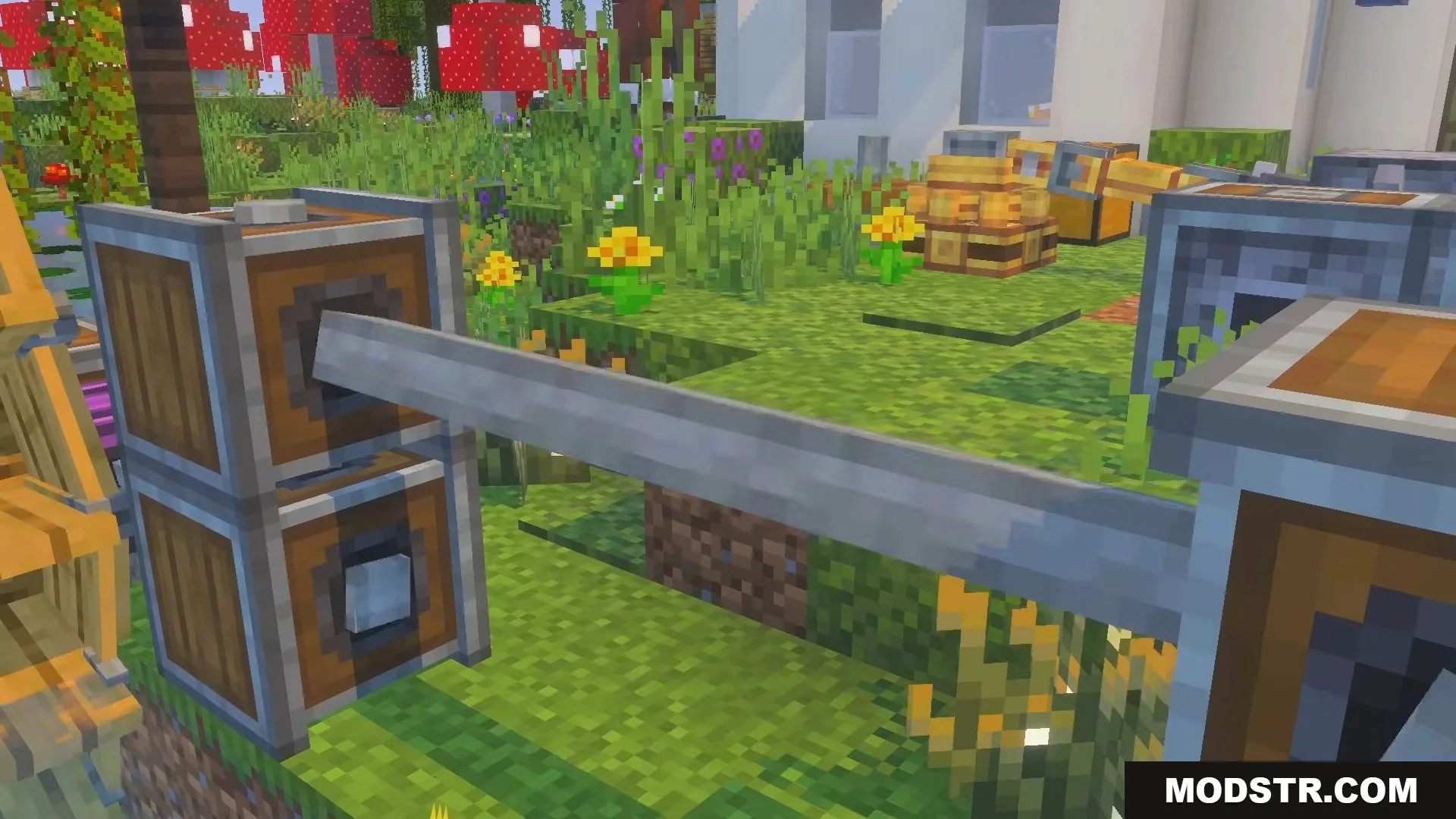 Wooden mechanical blocks connected by a metal shaft in a garden
