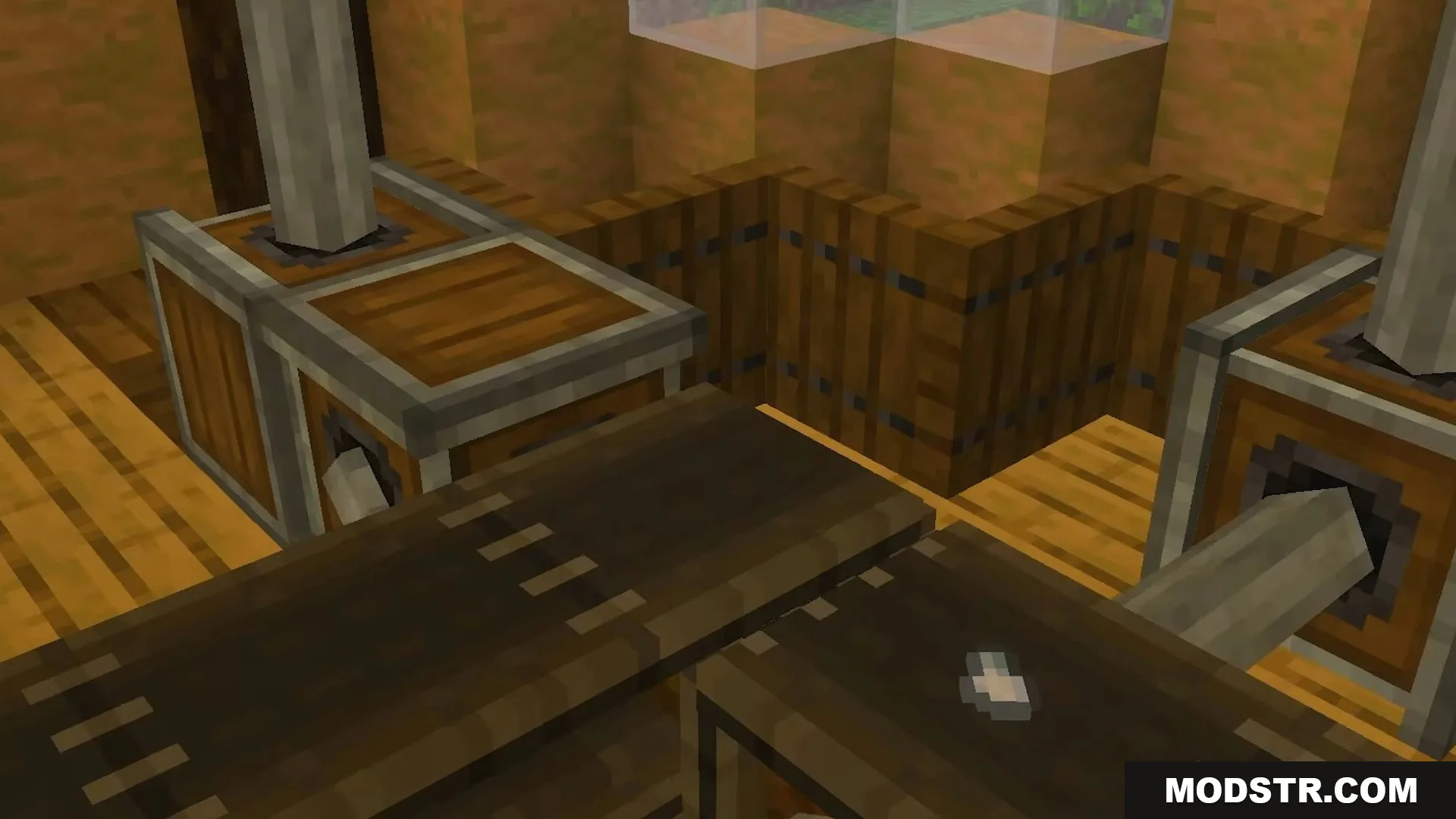 Conveyor belt moving small items between processing machines in a wooden factory setup