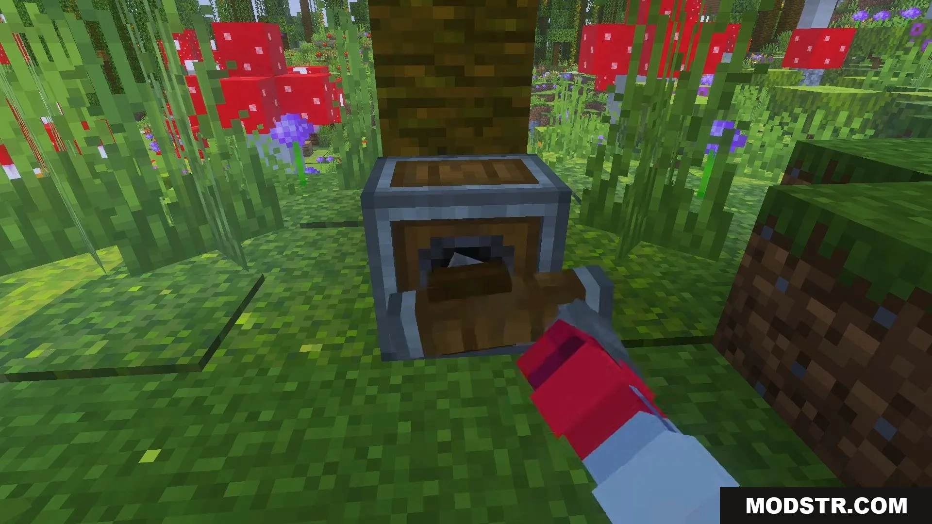Player using a wrench tool on a mechanical saw block near a tree