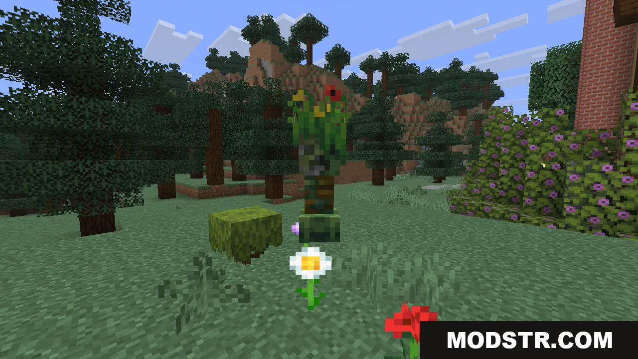 A leafy flowering creeper standing next to a mossy block, with a daisy and a poppy growing on the ground in front of it