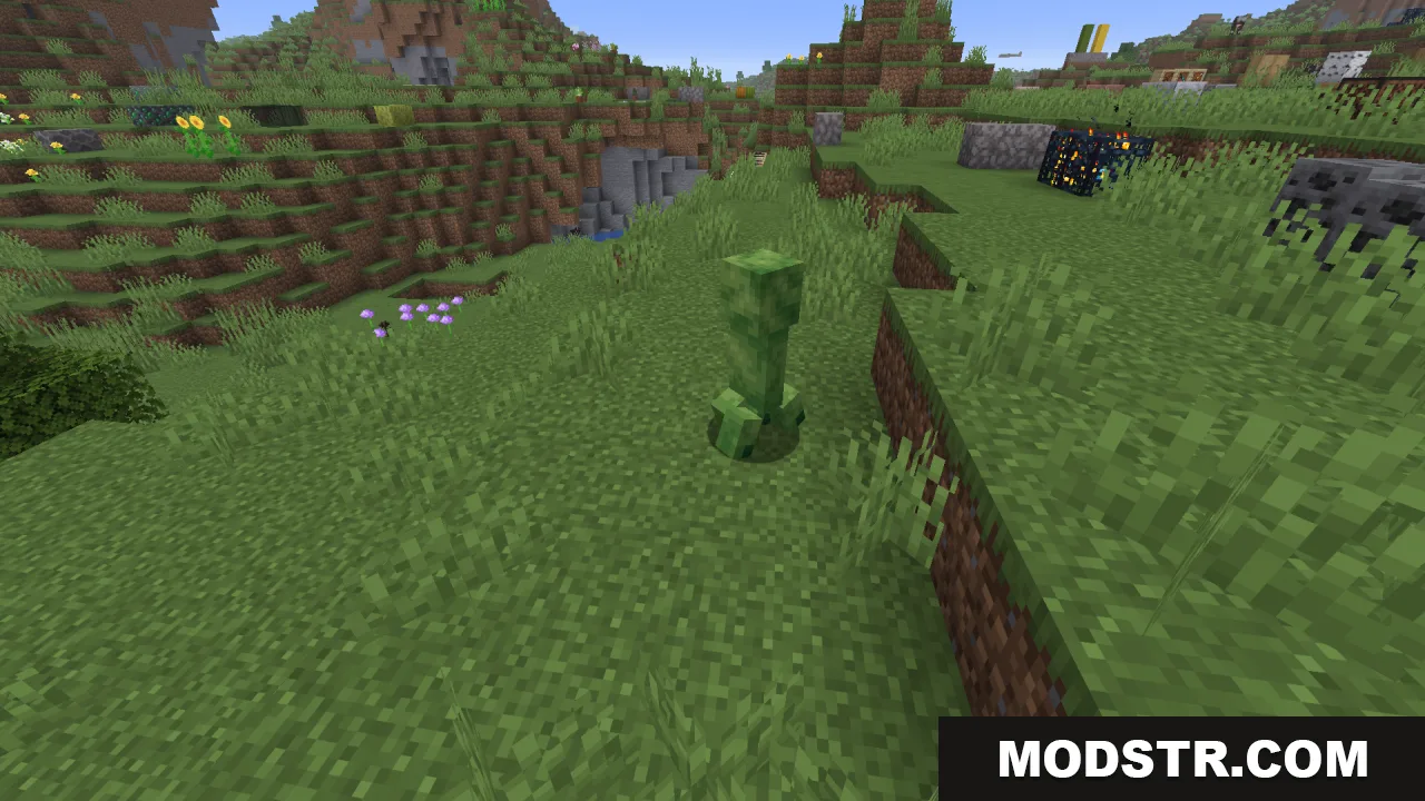 Creepers Refreshed Resource Pack Screenshot 5 A green Creeper stands on a grassy hill near a mob spawner