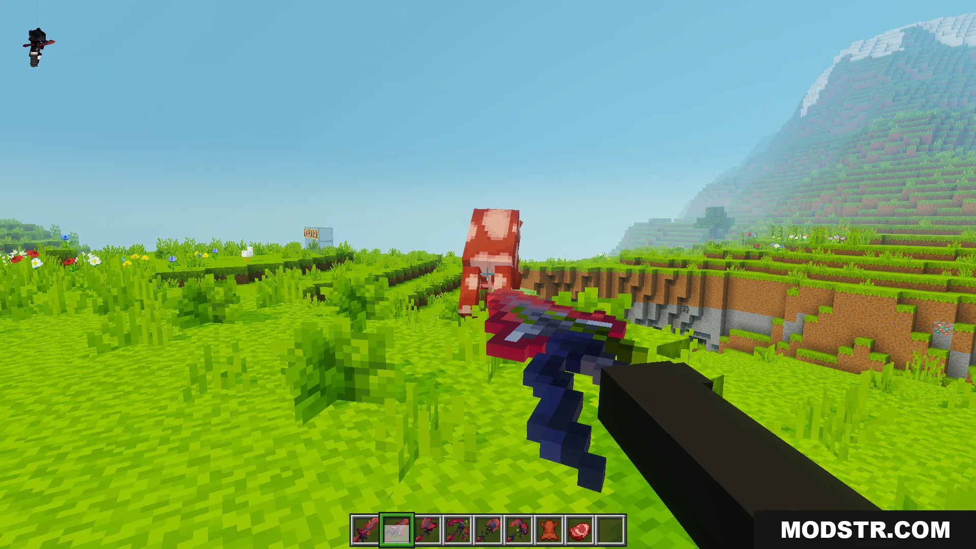 Player holding a custom red and blue sword aiming at a cow