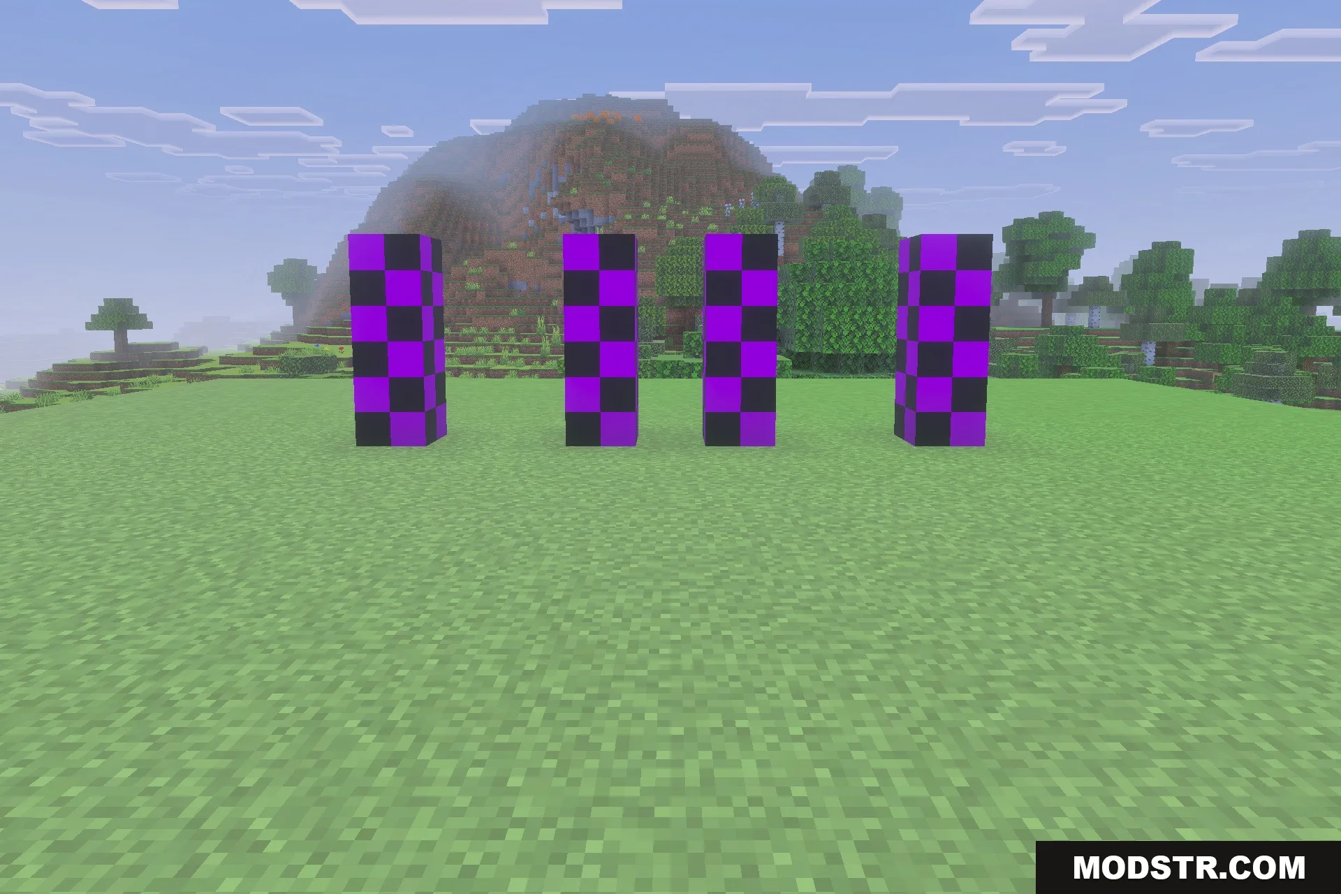 Decayed Reality V2.1 - Wither Storm Replica Addon Screenshot 5 Four pillars of purple and black checkered blocks in a grassy landscape