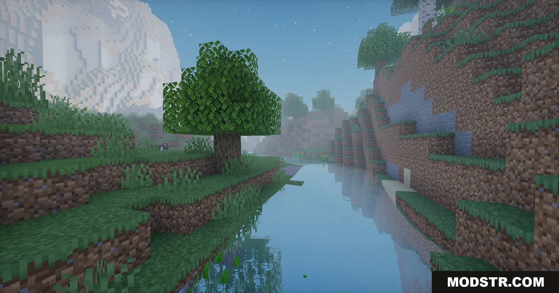 A peaceful river reflects the sky near a large mountain in Minecraft