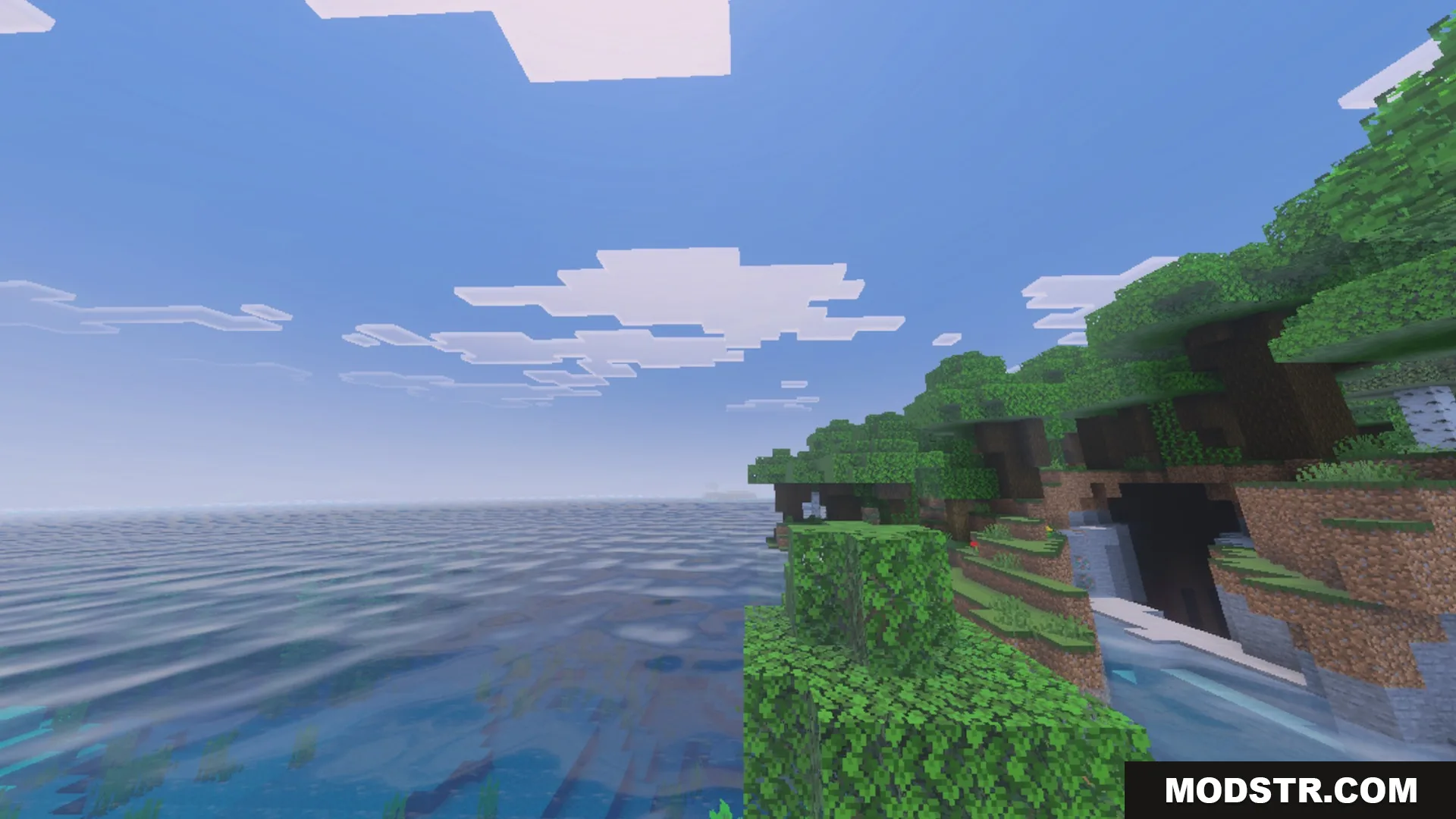 Dynamic Wave Shader Screenshot 2 Lush green shoreline overlooking a vast sea with realistic dynamic water wave effects