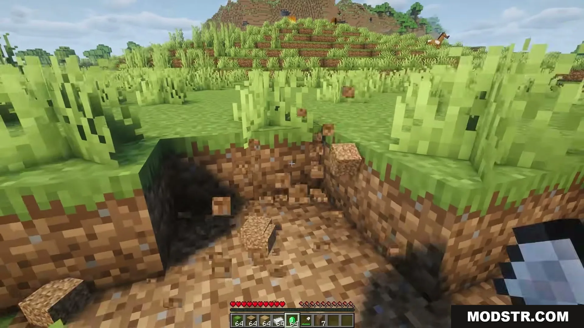 Eating Animations Mod Screenshot 1 Player digging a hole in the ground with dirt blocks breaking apart