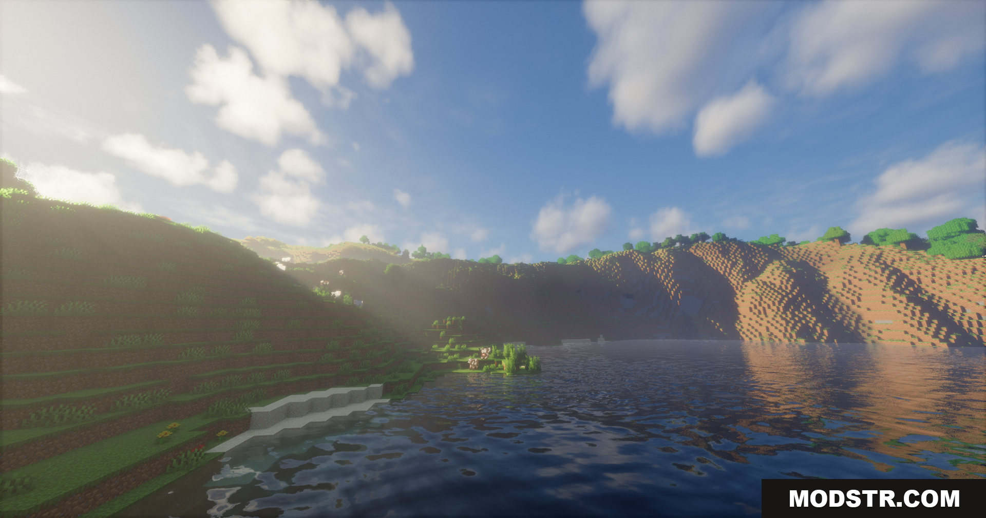 Emanrux Shaders Screenshot 12 Soft sunlight illuminating a grassy hillside next to rippling water