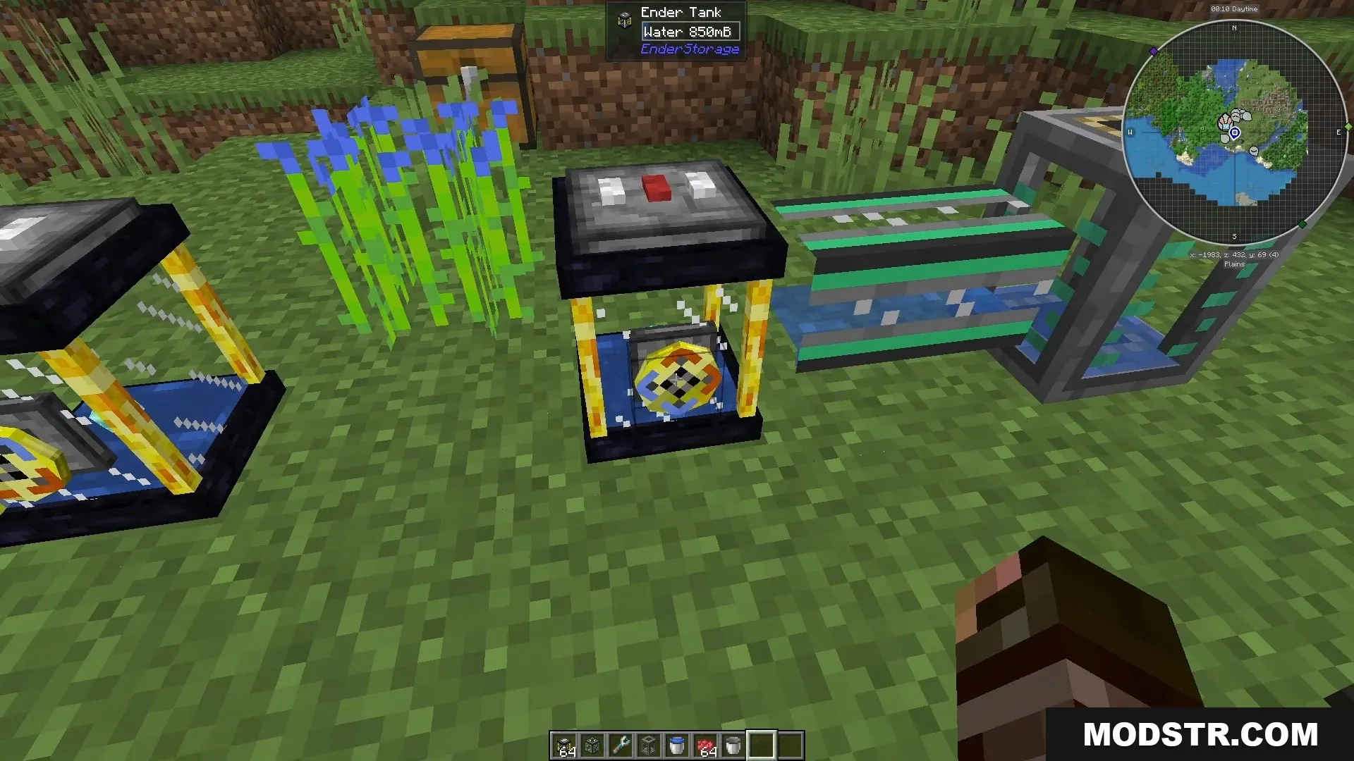 An Ender Tank storing water connected to pipes in a grassy field