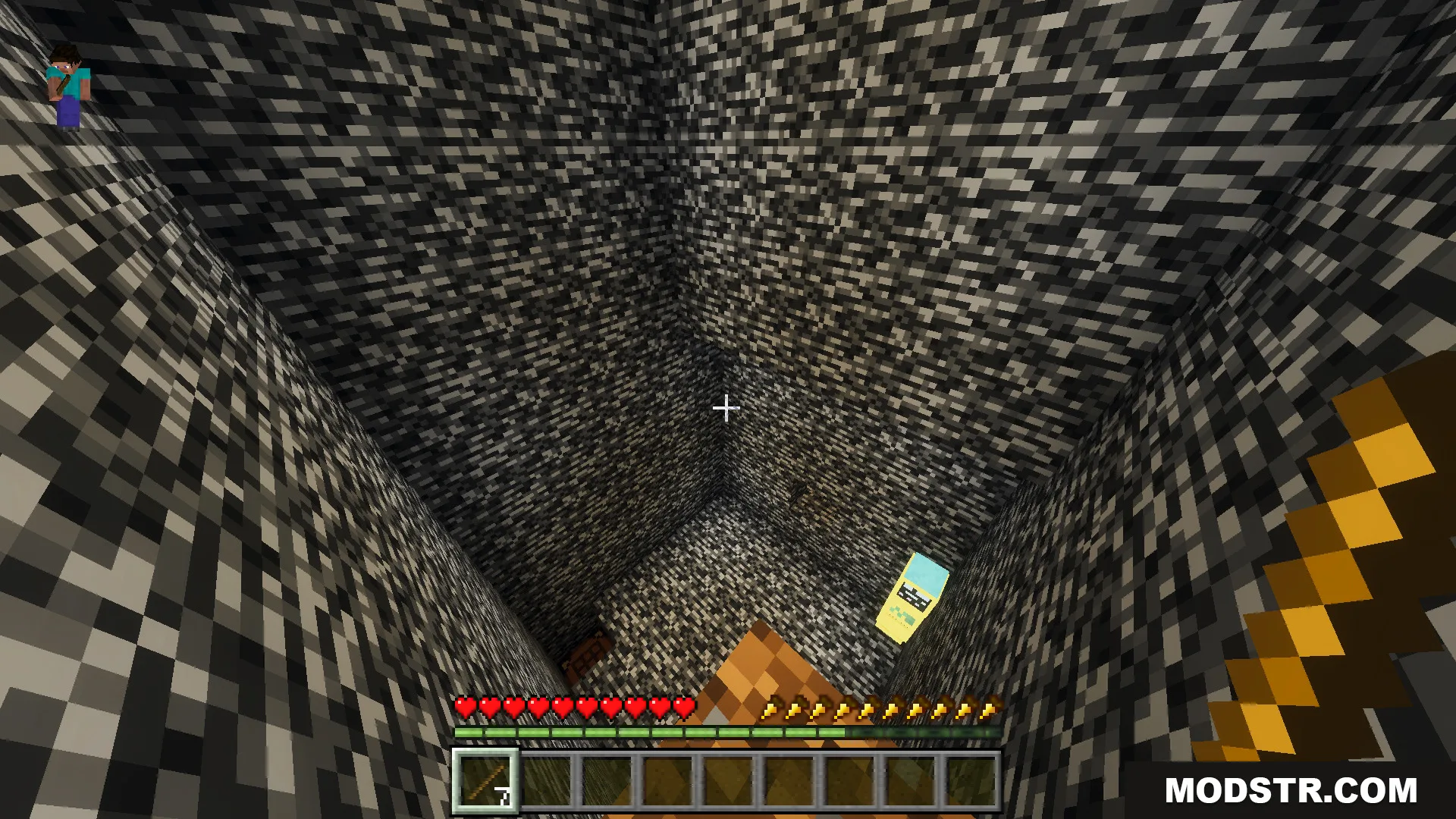 Player looking down a deep bedrock shaft towards a yellow character below