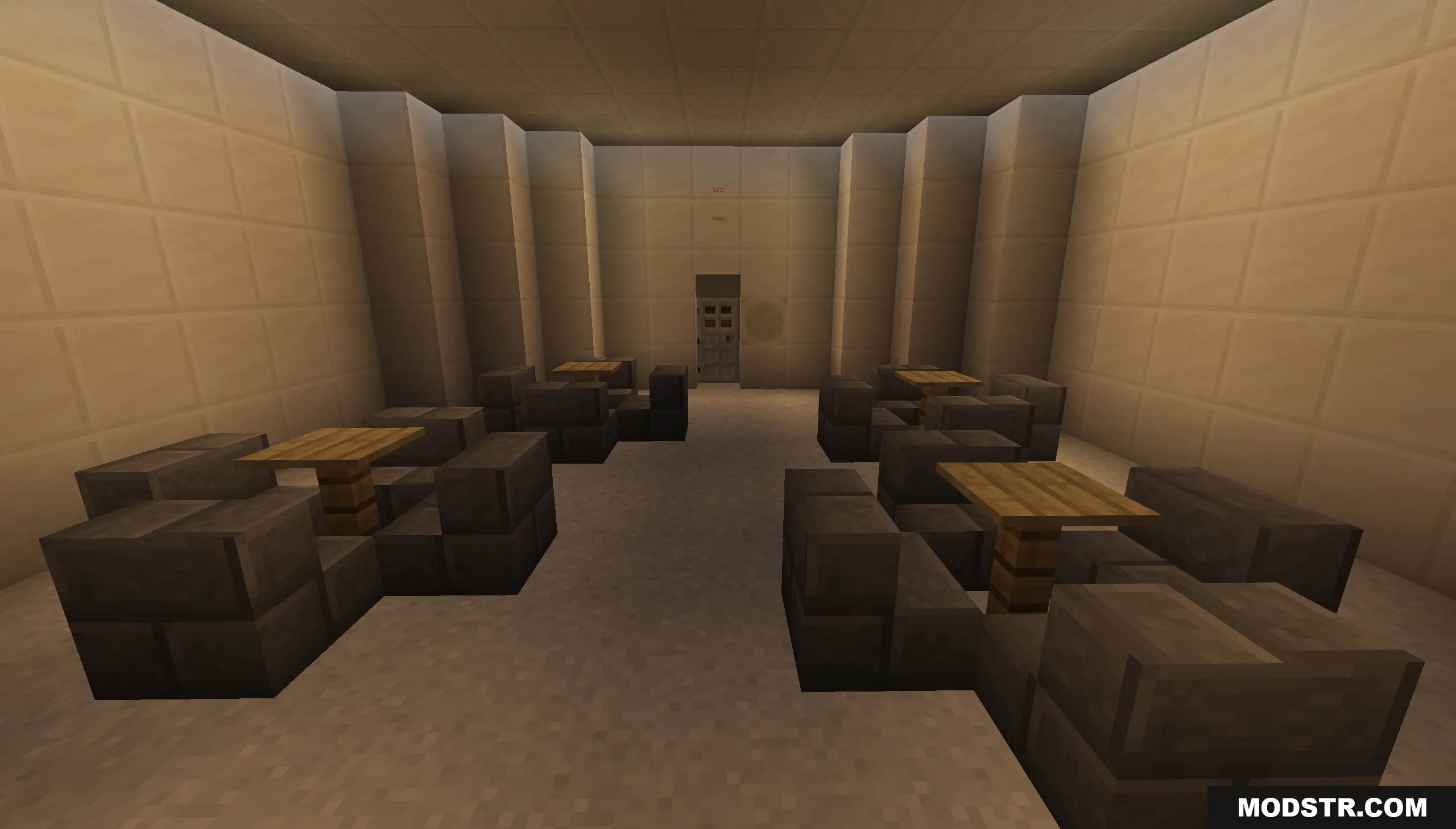 Empty prison cafeteria with wooden tables and dark stone seating areas
