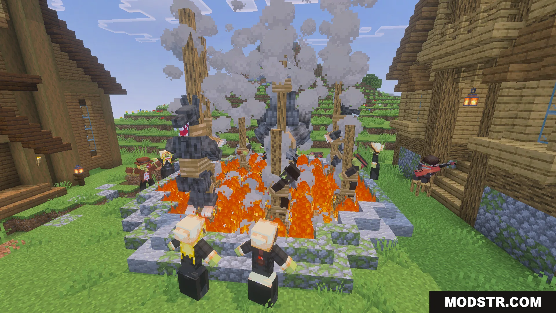 Scary werewolves tied to wooden stakes around a large campfire in a village