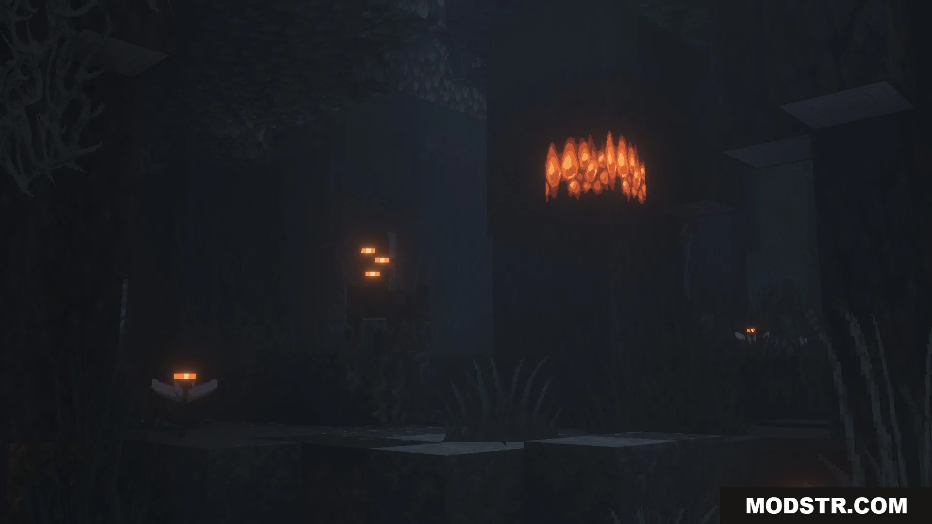 Bright orange crystals illuminating a dark cave with high resolution texture details