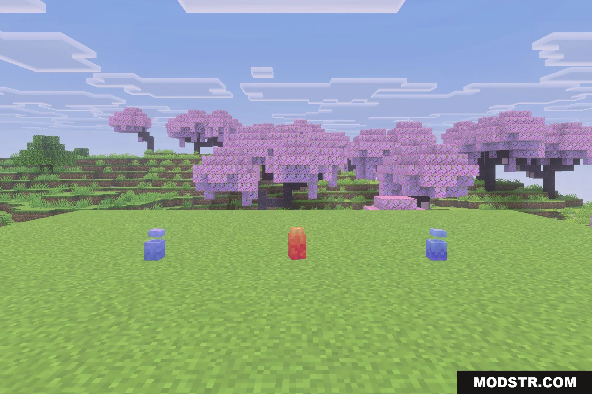 Fire and Steel Dragons Addon Screenshot 4 Three colorful dragon eggs from the Fire and Steel Dragons mod on grass