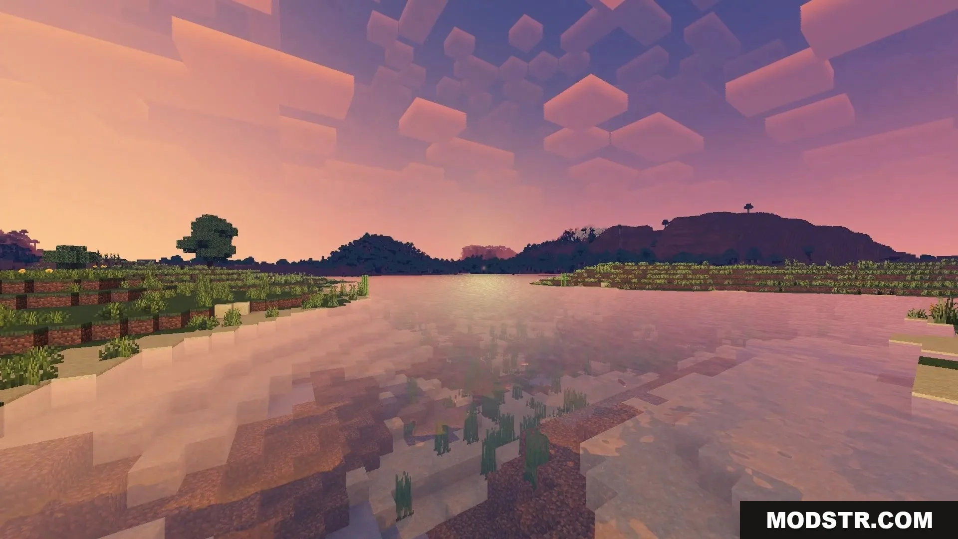 FirmamentCraft 5.0 Shader Screenshot 13 Scenic Minecraft sunset showing calm water reflections and blocky clouds over distant hills