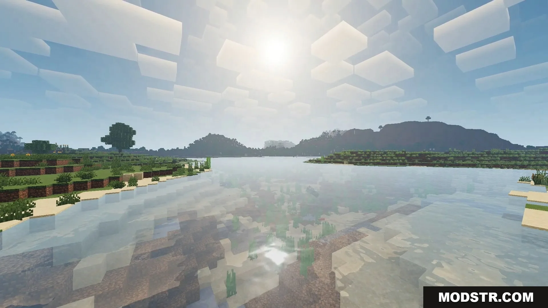 FirmamentCraft 5.0 Shader Screenshot 12 Sunny Minecraft landscape showing clear water reflections and blocky clouds in the sky