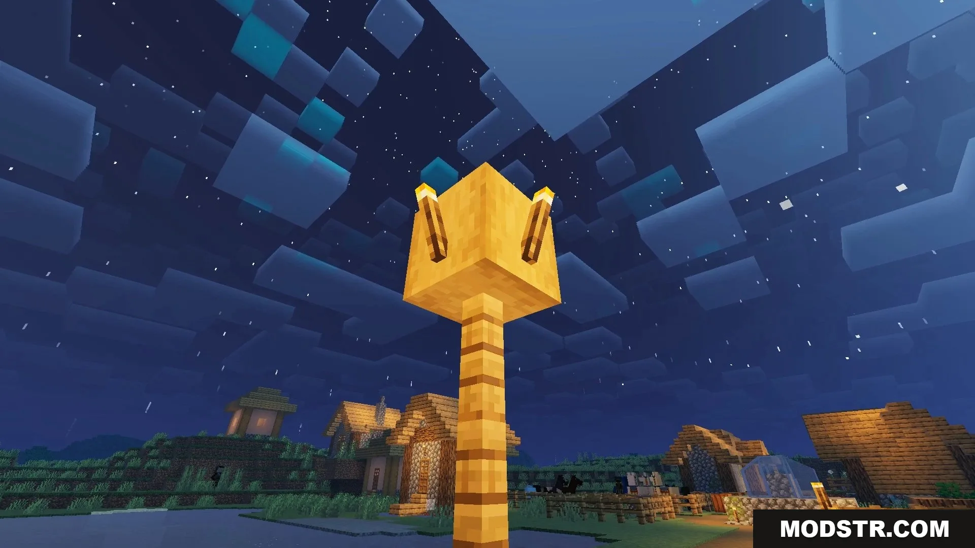 FirmamentCraft 5.0 Shader Screenshot 15 Nighttime view of a village with a glowing gold block lamp post