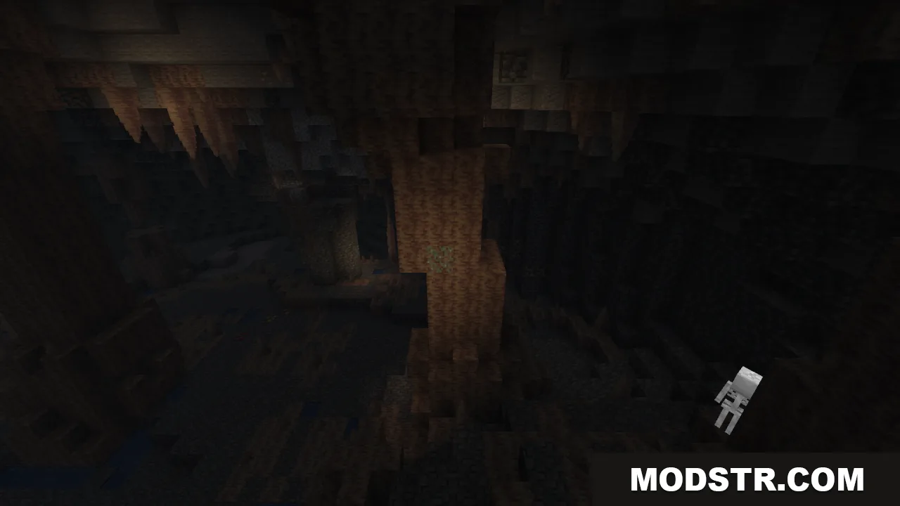 A dark Minecraft cave filled with stalactites and a skeleton mob