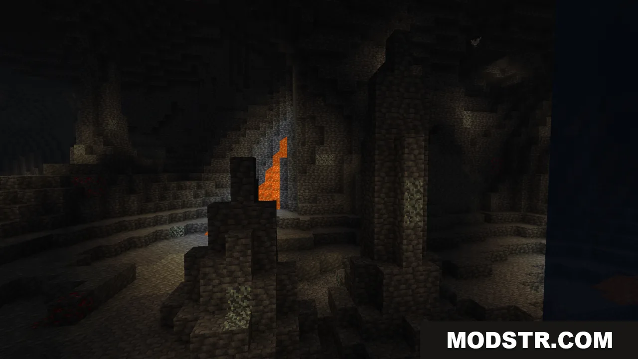 Dark underground cave in Minecraft with stone formations and distant lava