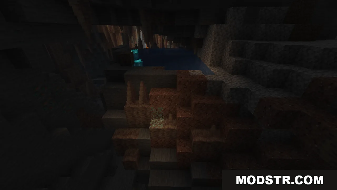A dark cave interior featuring a small pool of water and stalactites