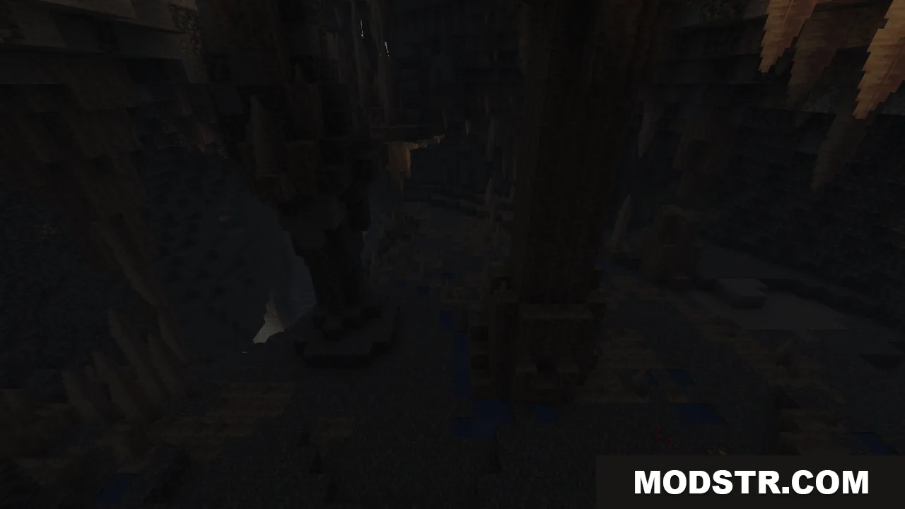 Dark underground cavern in Minecraft featuring sharp stalactites and rocky terrain