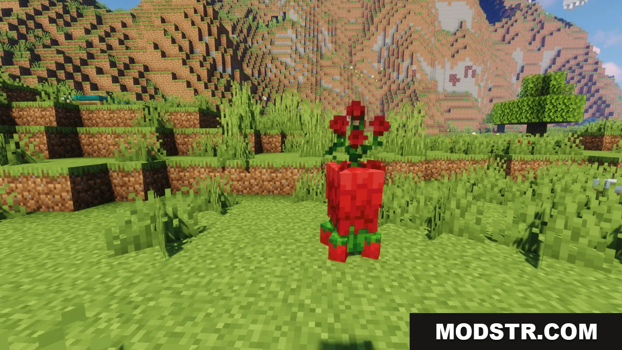 A short red creeper made of flower petals standing in a grassy area