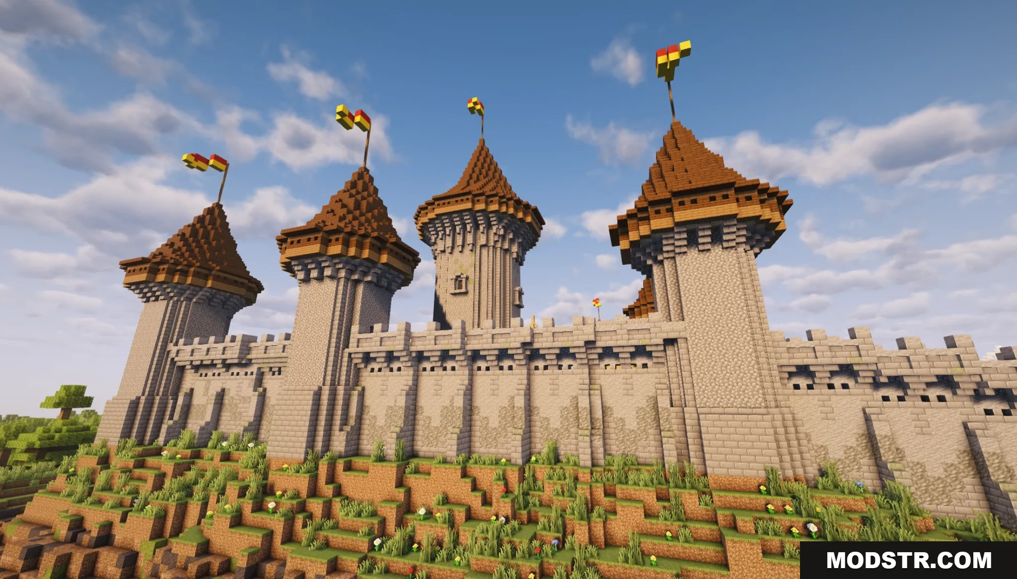 Gallardon Medieval Village Map Screenshot 2 Close up of stone castle towers with flags on a grassy hill
